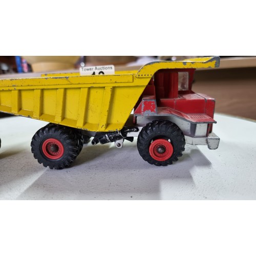 13 - Pair of large Dinky toy centaur diecast dump trucks in good condition height 9cm length 18cm