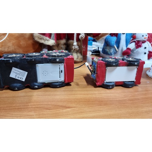 16 - Quantity of christmas ornaments inc a solar powered sants loco with light a battery powered two piec... 