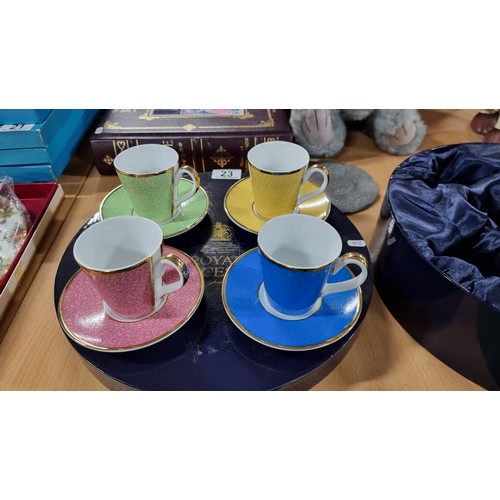 23 - Boxed unused Royal Worcester 4 piece cup and saucer set all of different colours in celebration of H... 