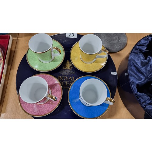 23 - Boxed unused Royal Worcester 4 piece cup and saucer set all of different colours in celebration of H... 