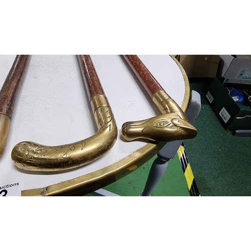 43 - 3x vintage walking sticks and a shooting stick inc 2x with brass handles the other has a rams horn h... 