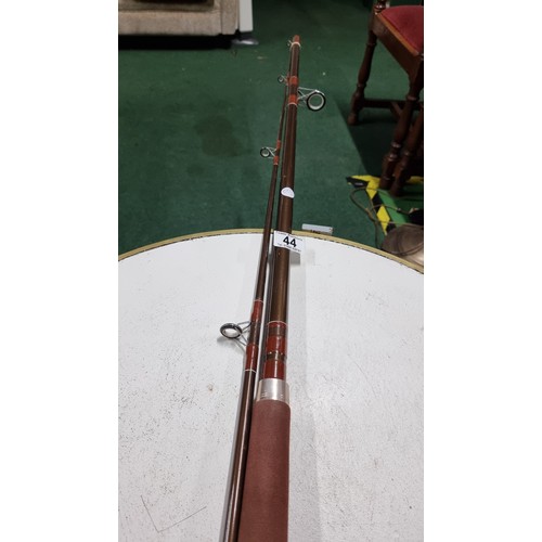 44 - Fly fishing rod 310cm long in good order along with a green fishing bag