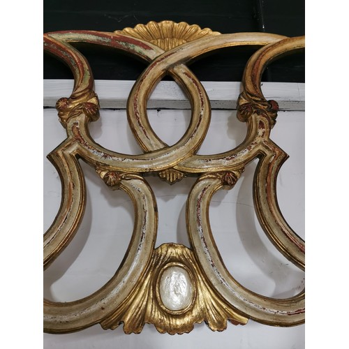 116 - Antique french headboard in a distressed gold paint showing an ornate classical French design. In go... 