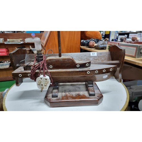 61 - Vintage wooden ship tv lamp along with a solid oak book trough in good order height of boat 60cm len... 