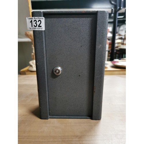 132 - Strong metal safe with key ideal for hanging on a wall complete with wall bracket. Measures 25cm hei... 