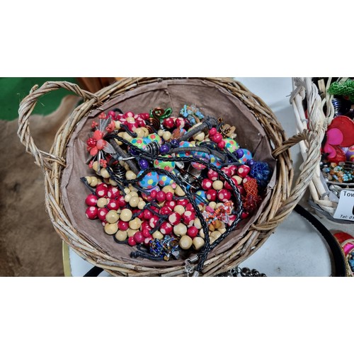 66 - 2x baskets containing a large quantity of various costume jewellery