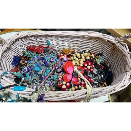 67 - 2x baskets containing a large quantity of various costume jewellery