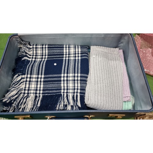 87 - Suitcase full of various ladies scarfs inc silk scarfs knitted scarfs large scarfs etc all been wash... 