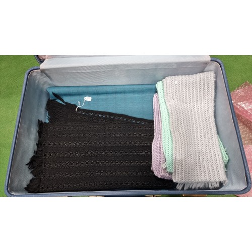 87 - Suitcase full of various ladies scarfs inc silk scarfs knitted scarfs large scarfs etc all been wash... 