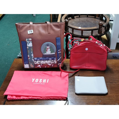 176 - Brand new leather Yoshi christmas themed handbag with dust cover and matching purses along with a re... 