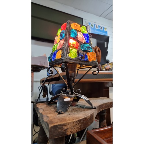 286 - Unusual iron table lamp with multi coloured glass faceted rock shade displays well when lit up  in g... 