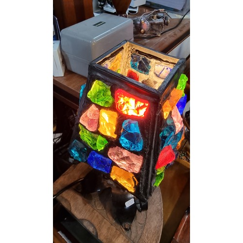 286 - Unusual iron table lamp with multi coloured glass faceted rock shade displays well when lit up  in g... 