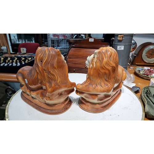 296 - Pair of antique staffordshire style Scottish Bo'ness pottery recumbent lions with painted features a... 