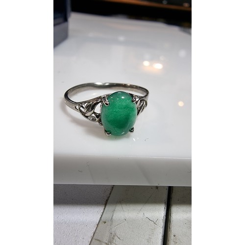 308 - Boxed 925 silver ring inset with a genuine green jade oval stone marked 925 size S all gems tested o... 