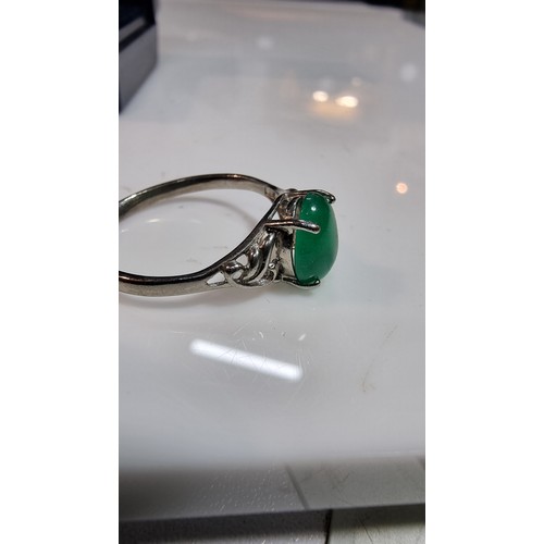 308 - Boxed 925 silver ring inset with a genuine green jade oval stone marked 925 size S all gems tested o... 