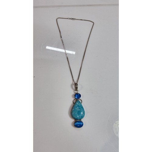 309 - Large ornate 925 silver pendant inset with a turquoise stone and 2x blue stones set on a good 16in 9... 