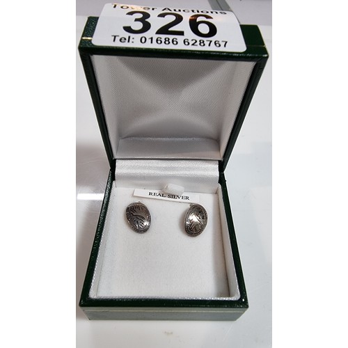 326 - Pair of boxed as new 925 silver earrings with an engraved design complete with their butterfly backs