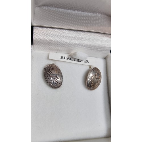 326 - Pair of boxed as new 925 silver earrings with an engraved design complete with their butterfly backs