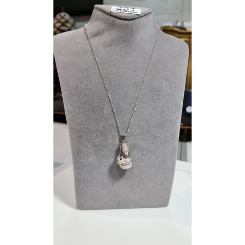 331 - Unusual solid 925 silver boxing glove pendant inset with cz stones set on an 20in 925 silver chain i... 