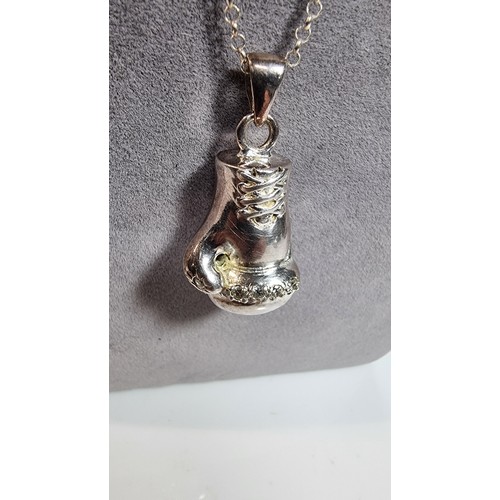 331 - Unusual solid 925 silver boxing glove pendant inset with cz stones set on an 20in 925 silver chain i... 