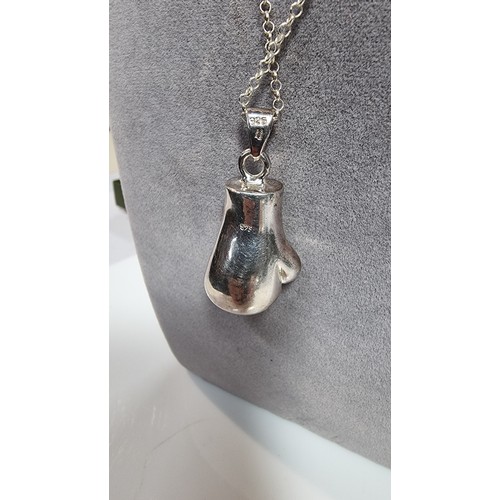 331 - Unusual solid 925 silver boxing glove pendant inset with cz stones set on an 20in 925 silver chain i... 