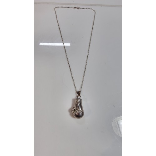 331 - Unusual solid 925 silver boxing glove pendant inset with cz stones set on an 20in 925 silver chain i... 