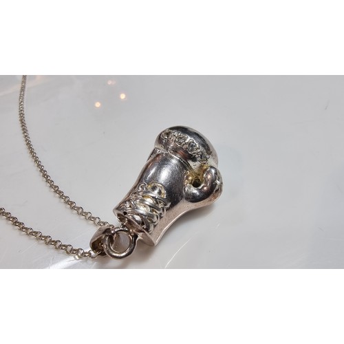 331 - Unusual solid 925 silver boxing glove pendant inset with cz stones set on an 20in 925 silver chain i... 