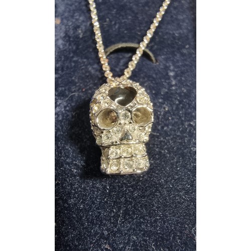 334 - Swarovski skull pendant on an 18in chain complete with original box and paperwork