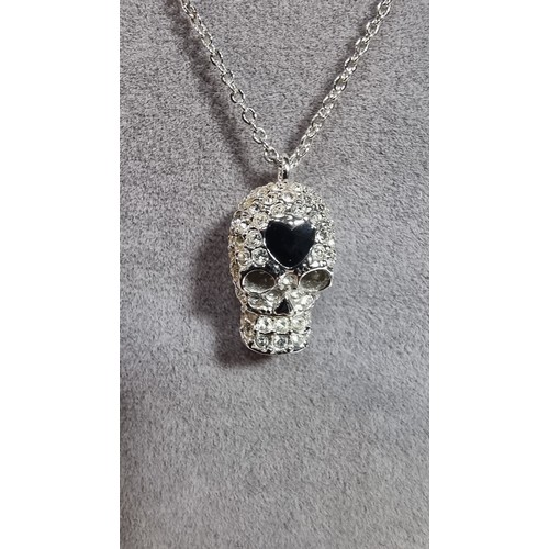 334 - Swarovski skull pendant on an 18in chain complete with original box and paperwork