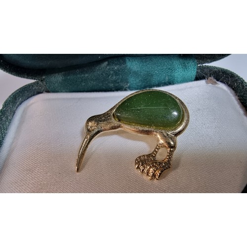 337 - Boxed as new curlew brooch by Ariki inset with nephrite jade 22ct gold plated made in New Zealand