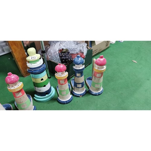 214 - Quantity of hand painted wooden lighthouse bathroom ornaments inc toilet roll holders, key cupboard ... 