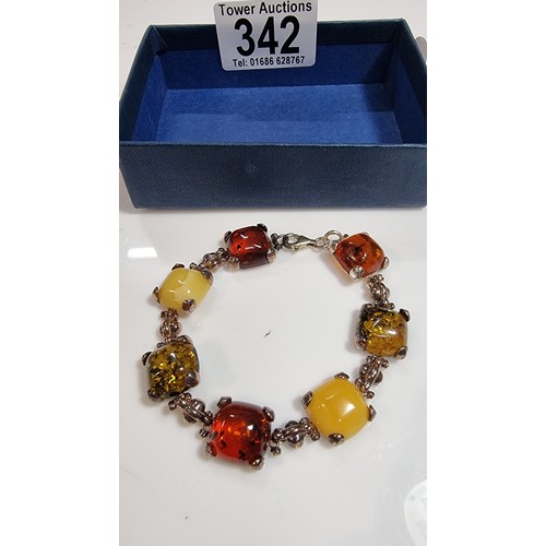 342 - 925 silver bracelet inset with tri coloured natural amber stones inc orange amber, green amber and y... 