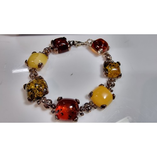 342 - 925 silver bracelet inset with tri coloured natural amber stones inc orange amber, green amber and y... 