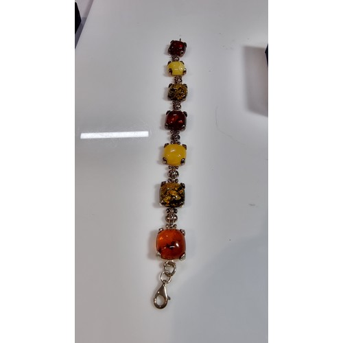 342 - 925 silver bracelet inset with tri coloured natural amber stones inc orange amber, green amber and y... 