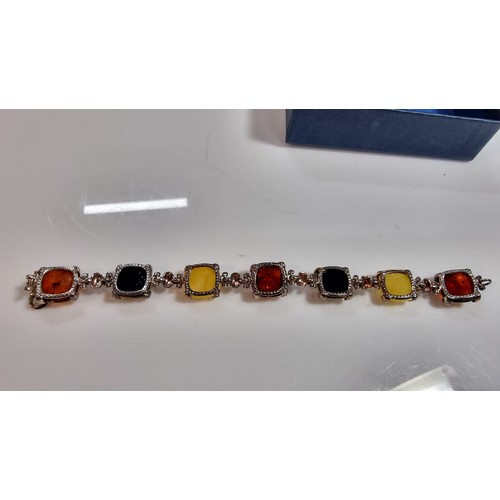 342 - 925 silver bracelet inset with tri coloured natural amber stones inc orange amber, green amber and y... 