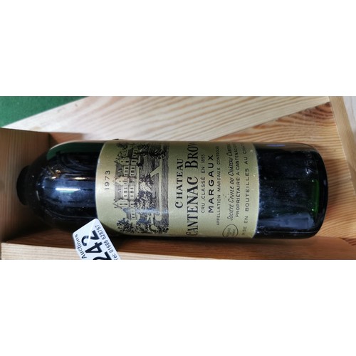 242 - Vintage 1973 Chateau Cantenac Brown Margaux bottle of red wine with bottle rest. The bottle has alwa... 