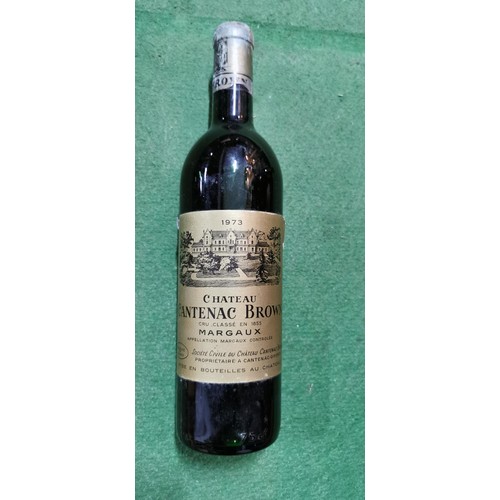 242 - Vintage 1973 Chateau Cantenac Brown Margaux bottle of red wine with bottle rest. The bottle has alwa... 