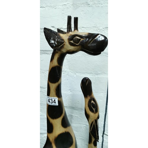 434 - Well-made hand carved wooden mother giraffe with her calf. Repair to the neck on one of the giraffes... 