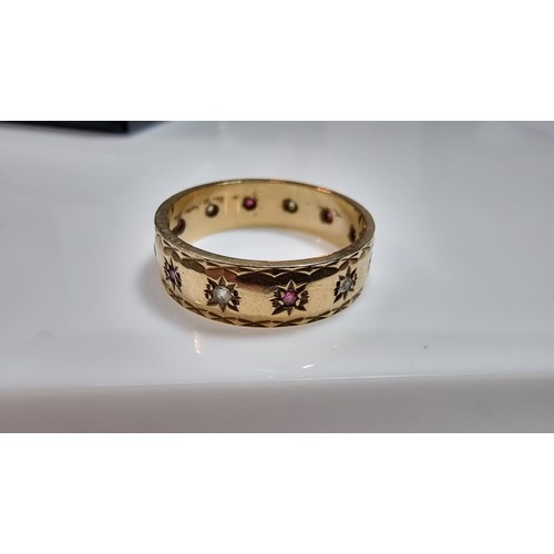 370 - Hallmarked yellow gold eternity ring inset with ruby stones and white topaz stones all the way round... 