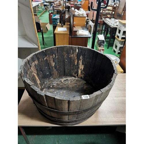 139 - Very large vintage wide oak barrel planter with original metal straps, requires wetting to expand. M... 