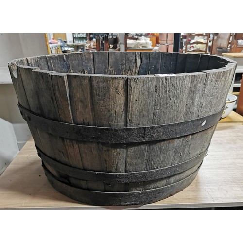 139 - Very large vintage wide oak barrel planter with original metal straps, requires wetting to expand. M... 