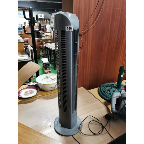 146 - Challenge grey tower fan heater in clean working condition.