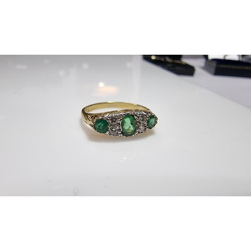 373 - Stunning 18ct yellow gold emerald and diamond ring size L 1/2 inset with 3x green emerald stones 0.3... 