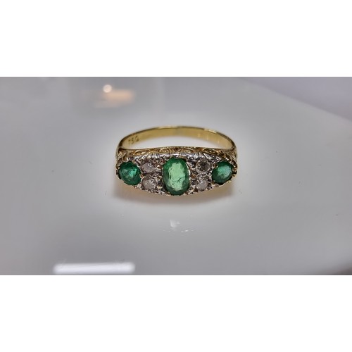 373 - Stunning 18ct yellow gold emerald and diamond ring size L 1/2 inset with 3x green emerald stones 0.3... 