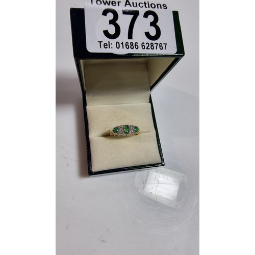 373 - Stunning 18ct yellow gold emerald and diamond ring size L 1/2 inset with 3x green emerald stones 0.3... 