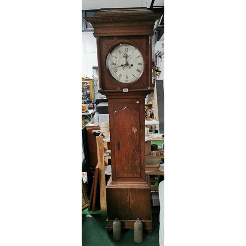 200 - Large oak antique long case striking grandfather clock complete with weights. has a cupboard to the ... 