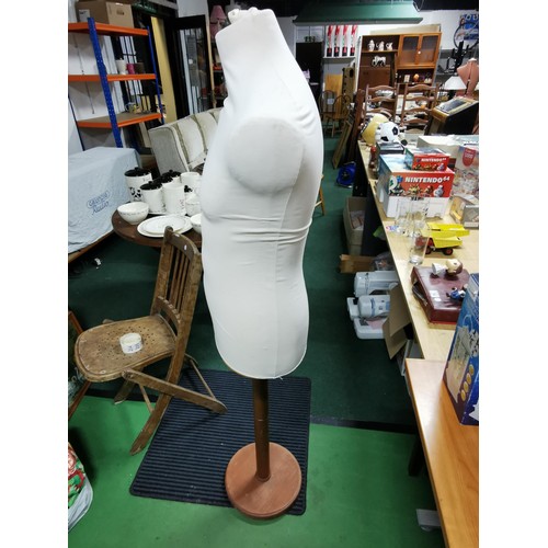 203 - Large shop display mannequin made from a strong hard foam on a wooden stand. Measures 150cm height.