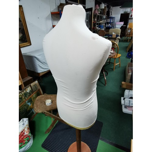 203 - Large shop display mannequin made from a strong hard foam on a wooden stand. Measures 150cm height.