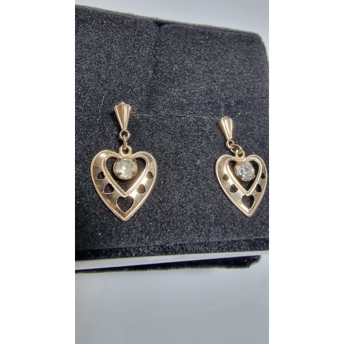 380 - Pair of 9ct yellow gold heart drop earrings inset with cz crystal stones in good clean condition box... 