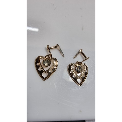 380 - Pair of 9ct yellow gold heart drop earrings inset with cz crystal stones in good clean condition box... 